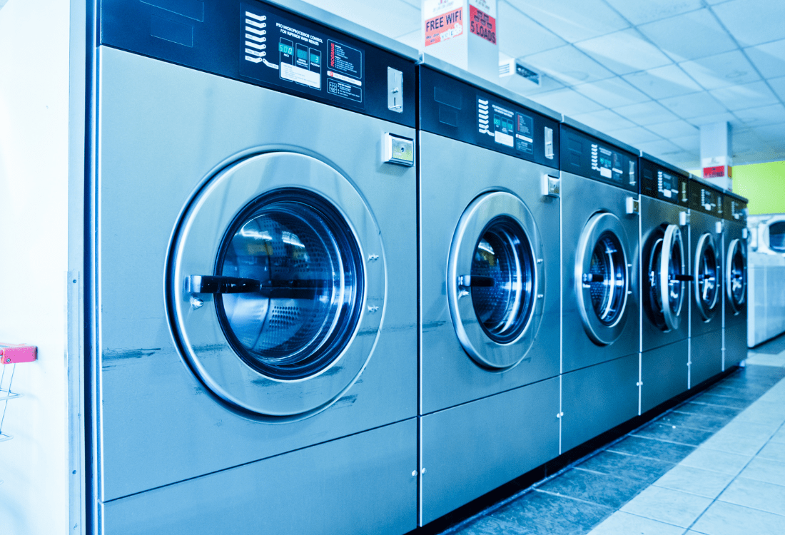 A bank of washing machines at a hospital that are regularly filled with infection-ridden items, safely handled within water-soluble alginate laundry bags.